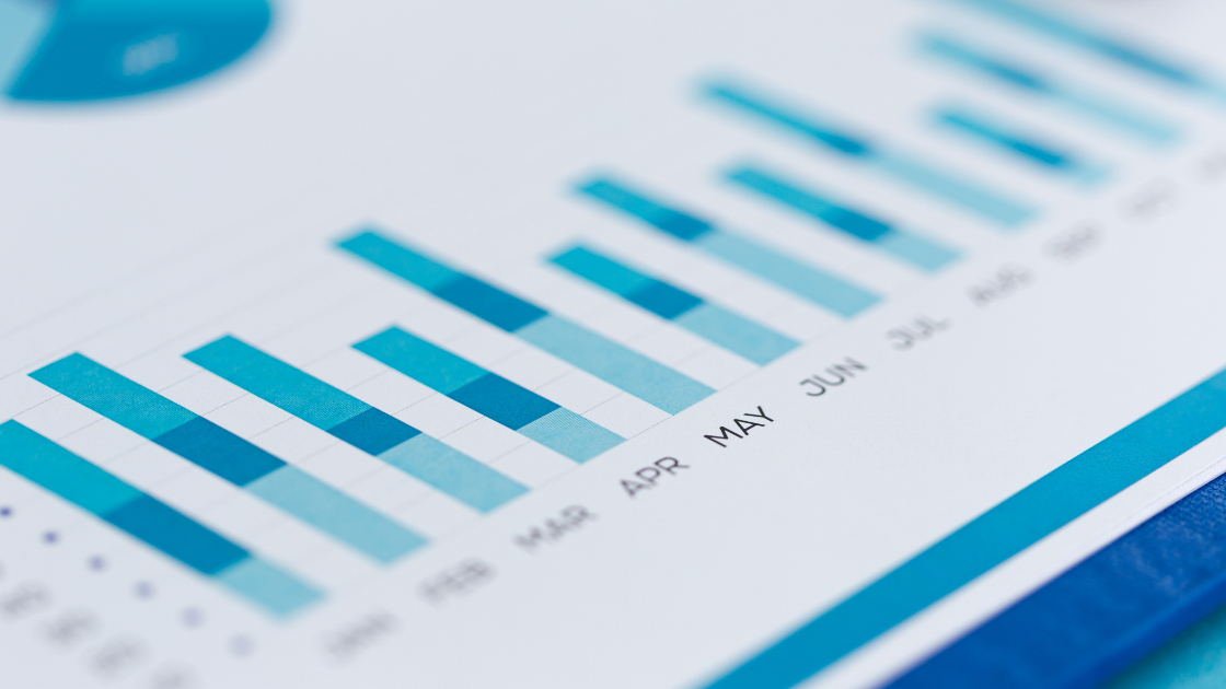 Blue graph on piece of paper, IMPLEMENT STRATEGIC DASHBOARDS WITH GOOGLE DATA STUDIO REPORTING