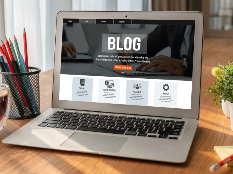 Blog website design on a laptop screen featuring a clean layout and engaging visuals.