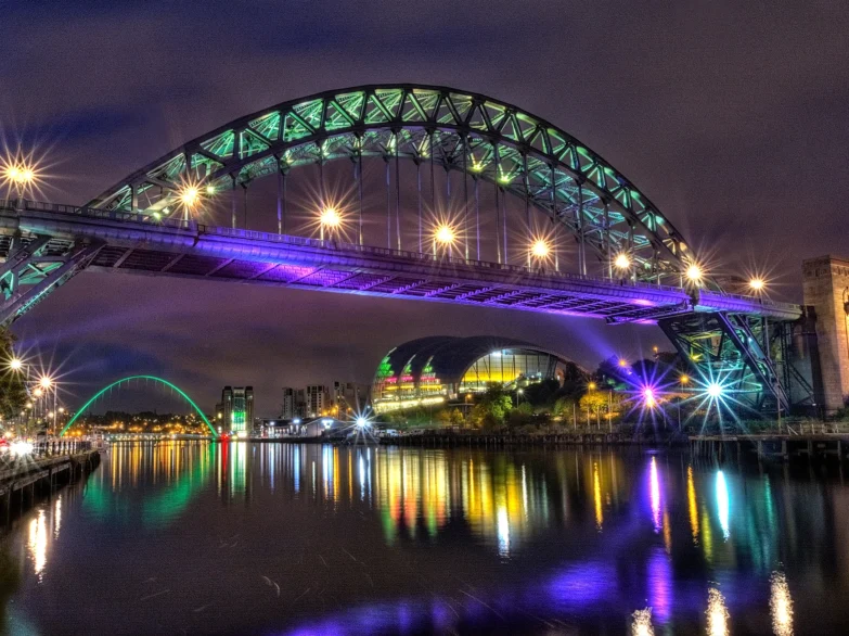 Tyne Bridge illuminated at night.
