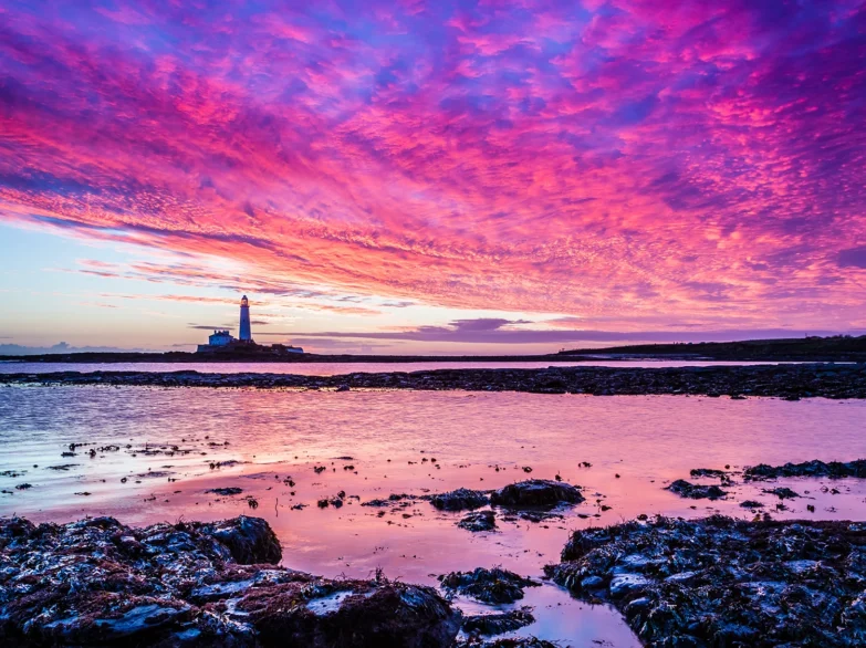 St Mary's Lighthouse, Whitley Bay with a vivid sunset.
